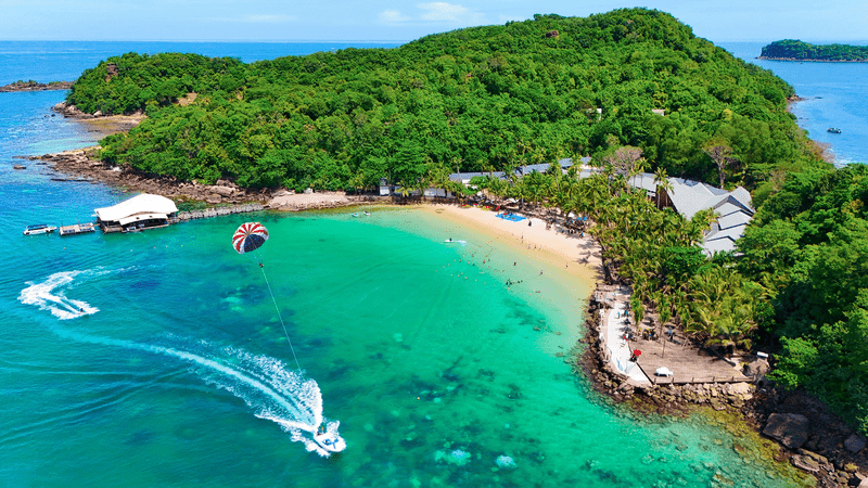 Head to Phu Quoc Island, which offers a view to the bright blue waters, pristine beaches, coral reefs, and green rainforests.