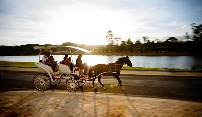 Horse carriages circling bring an old-world charm to this scenic lakeside.