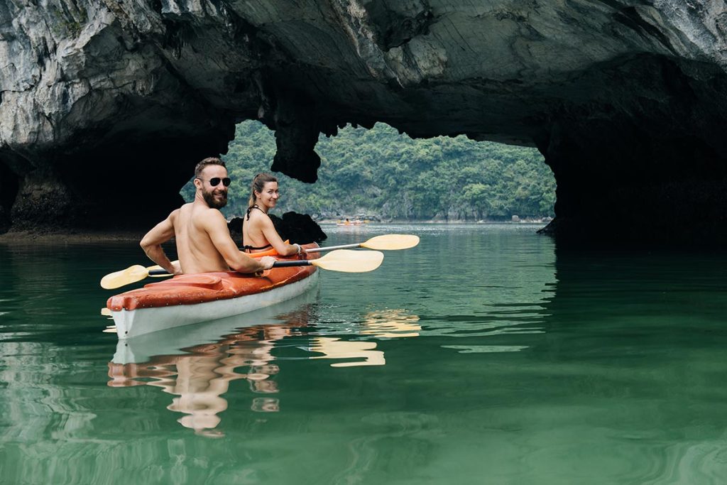 Kayaking along the Chay River with crystal-clear water, surrounding limestone cliffs