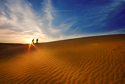 The Red Sand Dunes are a vibrant spectacle of reddish-brown sands