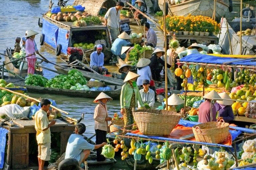 A boat trip along the Hau River to the Cai Rang Floating Market