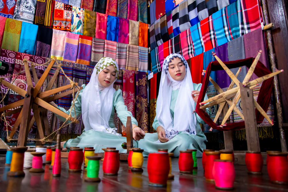 Women in Cham traditional dress and hijabs